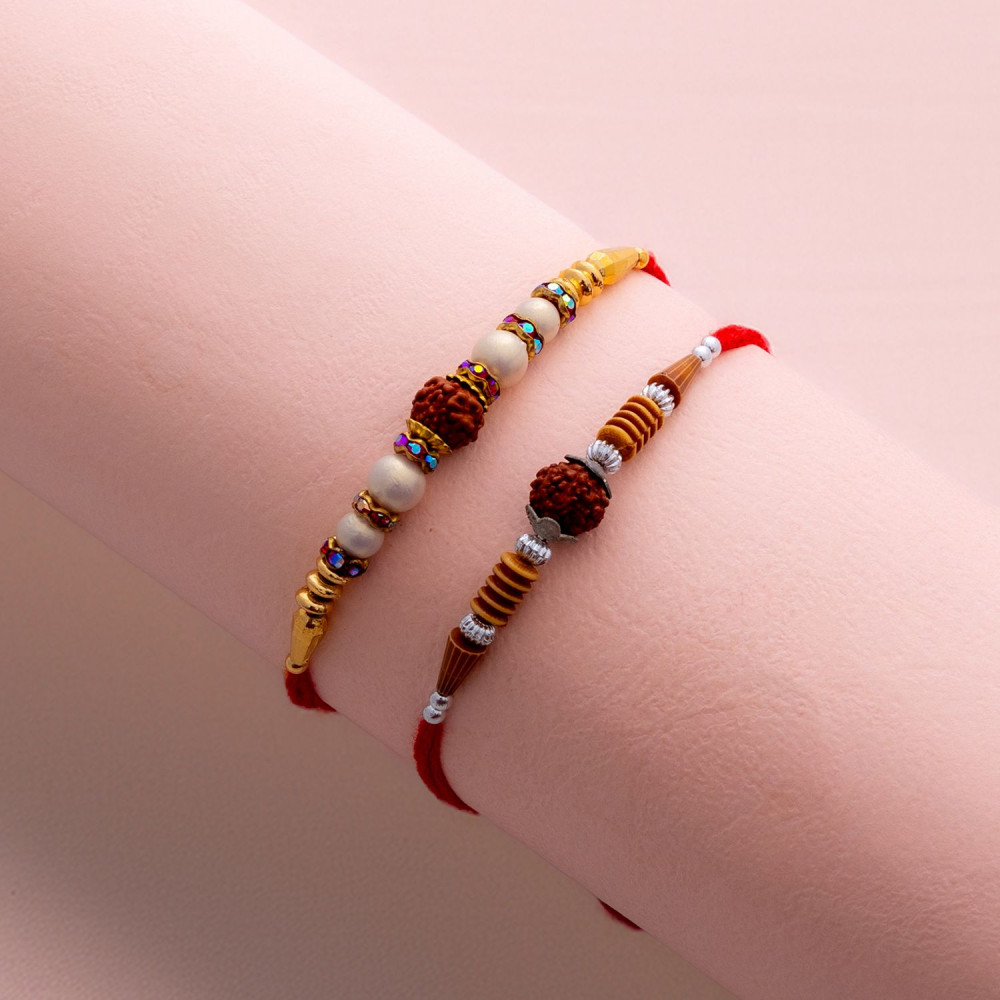 Vibrant Set of 2 Rakhis with Pearls and Rudraksh Vibrant Set of 2 Rakhis with Pearls and Rudraksh